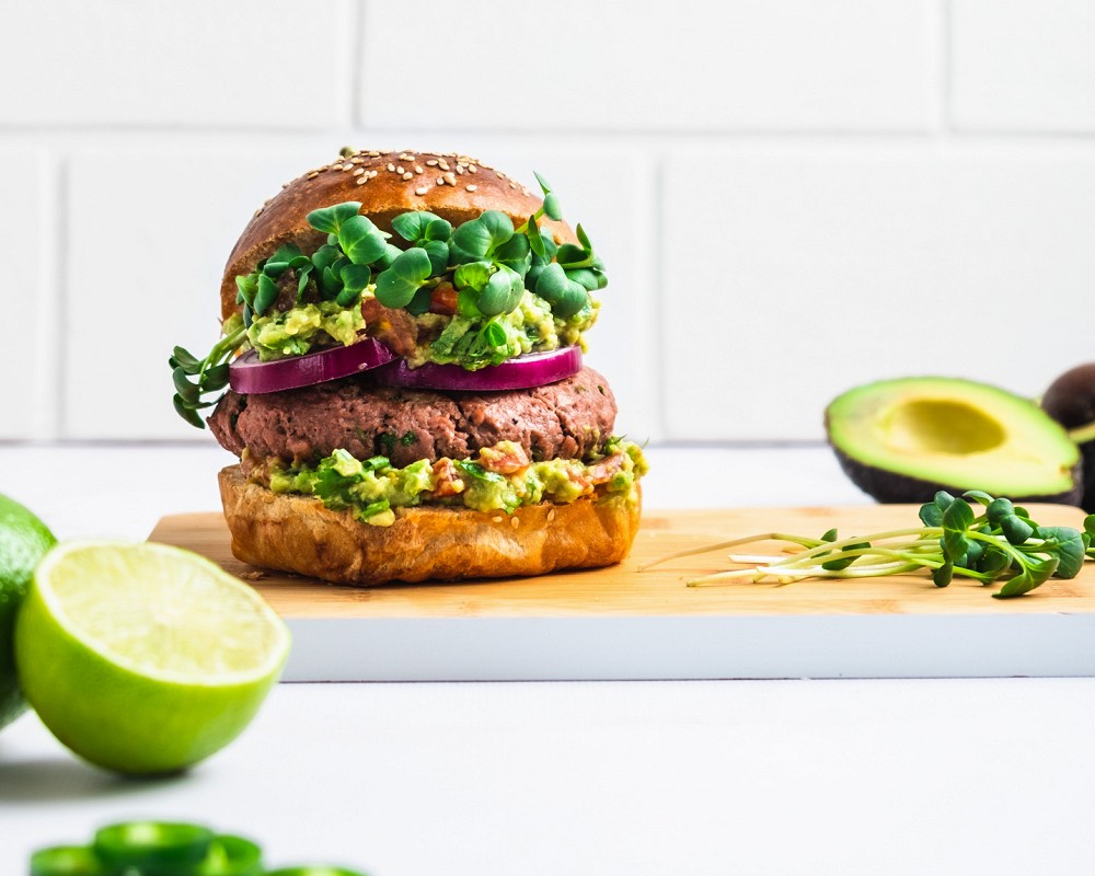 Burger with guacamole sauce and Eat Me At